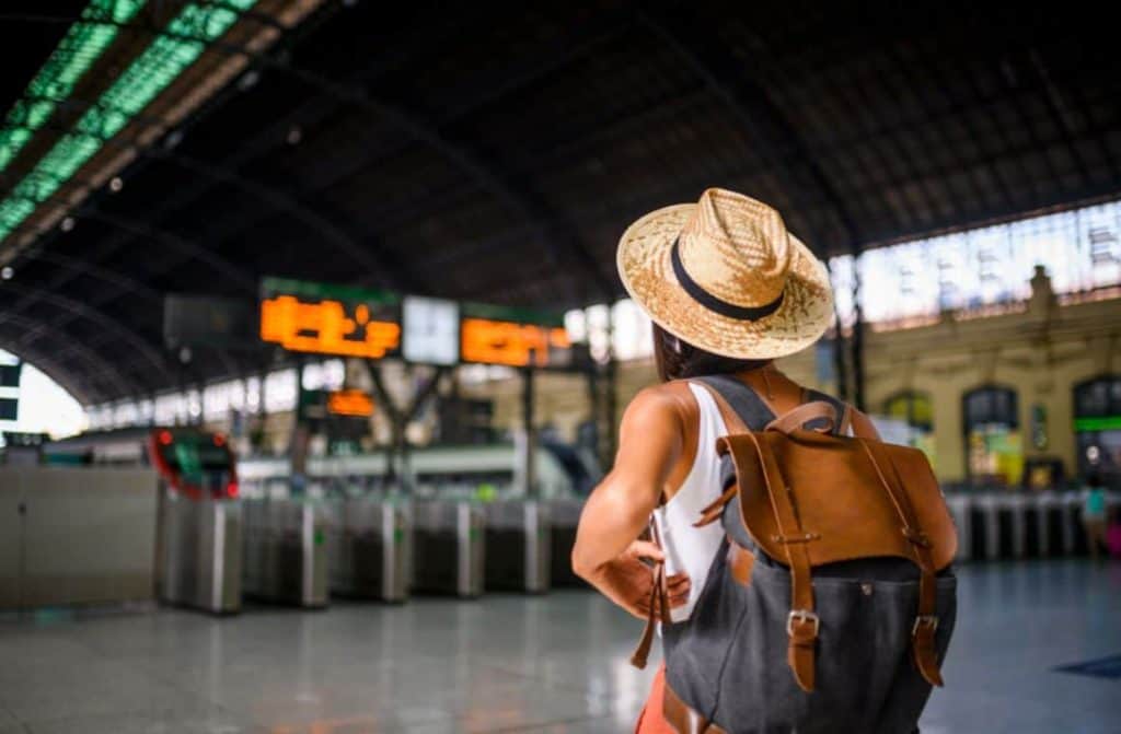 30 Top Pre-Flight Tips for Stress-Free Travel: Expert Guide. Confident traveller navigating through a bustling airport terminal, ready for an adventure