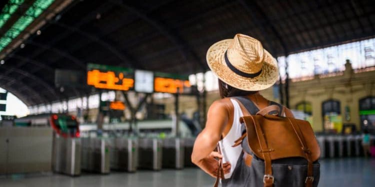 Confident traveller navigating through a bustling airport terminal, ready for an adventure