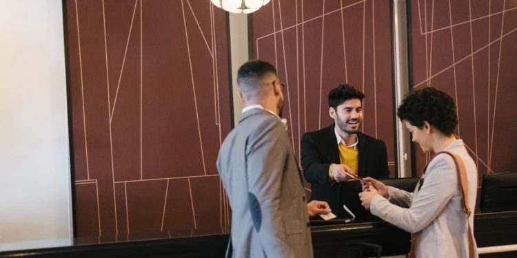 a business couple at the reception of a business hotel