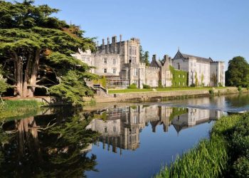 A striking medieval castle hotel nestled amidst verdant countryside, offering guests a regal retreat and a timeless journey into the U.K.'s storied past.