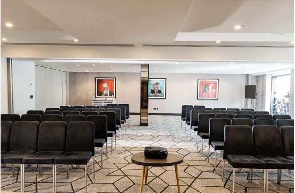 Contemporary and stylish conference suite at The Malmaison hotel Birmingham, featuring modern amenities and comfortable seating for productive meetings and events being featured in the article, "10 Best Business Hotels with Conference Facilities in Birmingham"