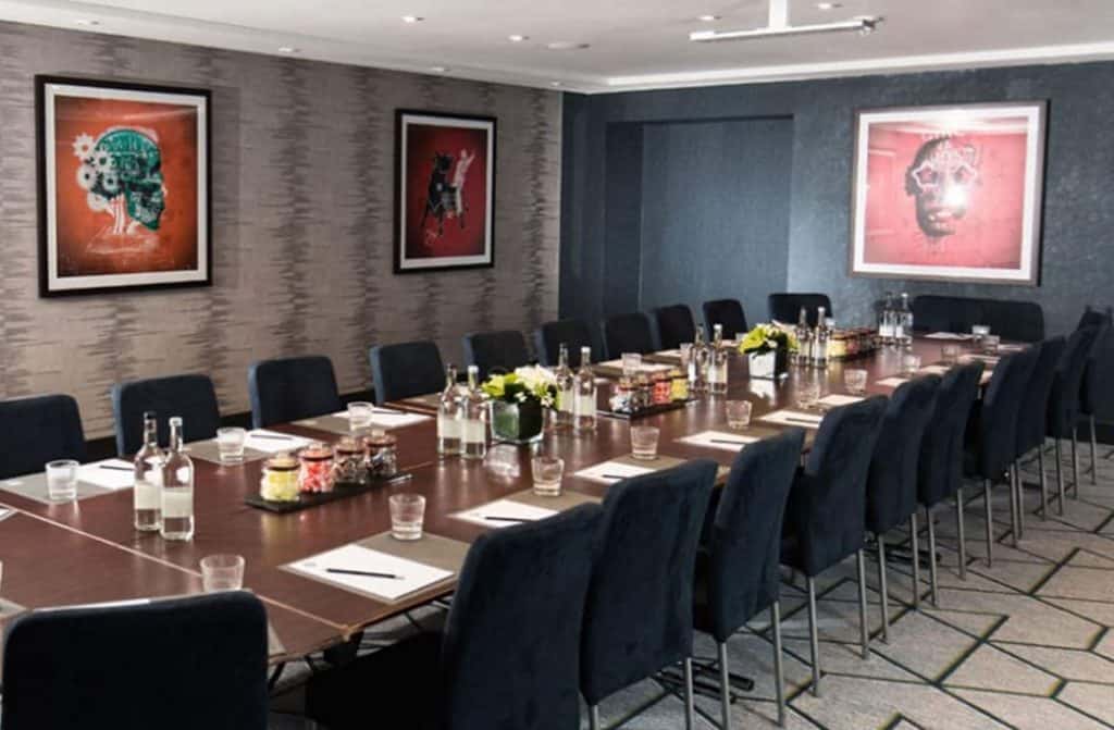 Contemporary and stylish business suite at The Malmaison hotel Birmingham, featuring modern amenities and comfortable seating for productive meetings and events - featured in the article, "10 Best Business Hotels with Conference Facilities in Birmingham"
