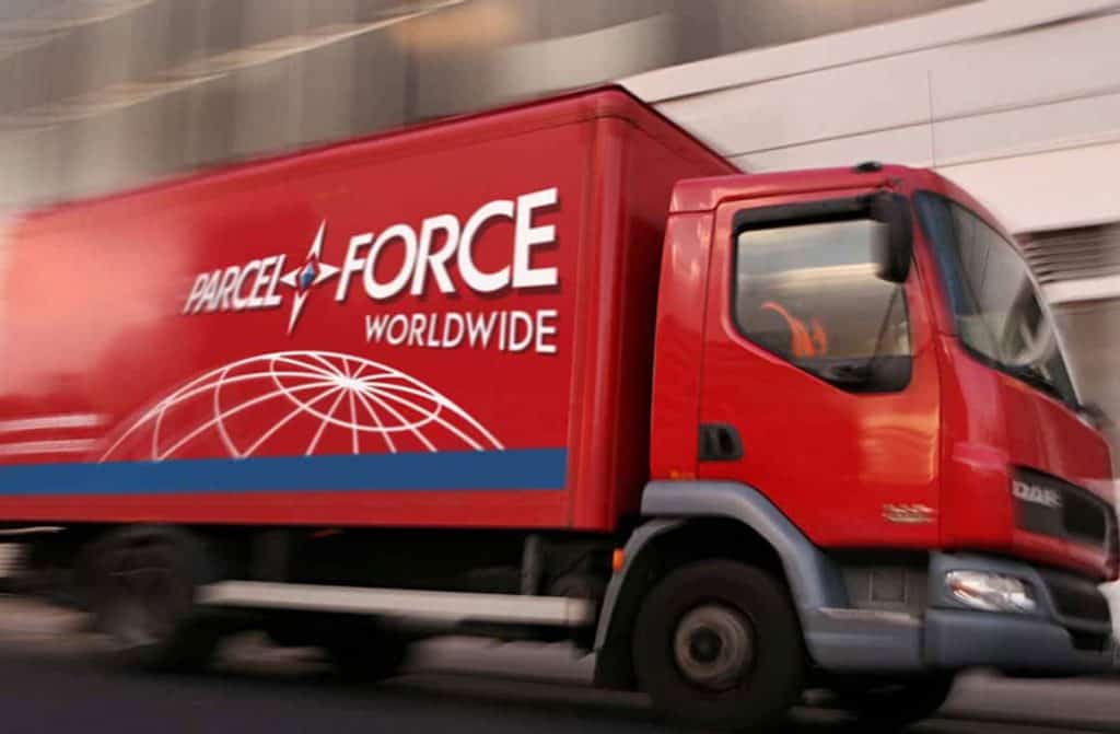  A ParcelForce van parked on a city street, ready to deliver packages