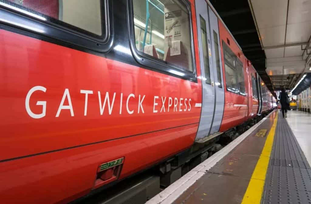 A sleek Gatwick Express train pulling into the station, ready to transport passengers to and from the airport affordably.