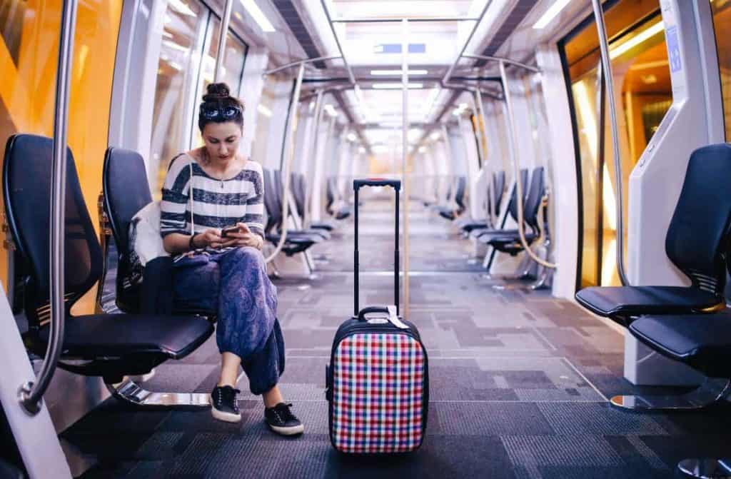 Passengers on a train, utilizing affordable means to reach the airport in the UK.