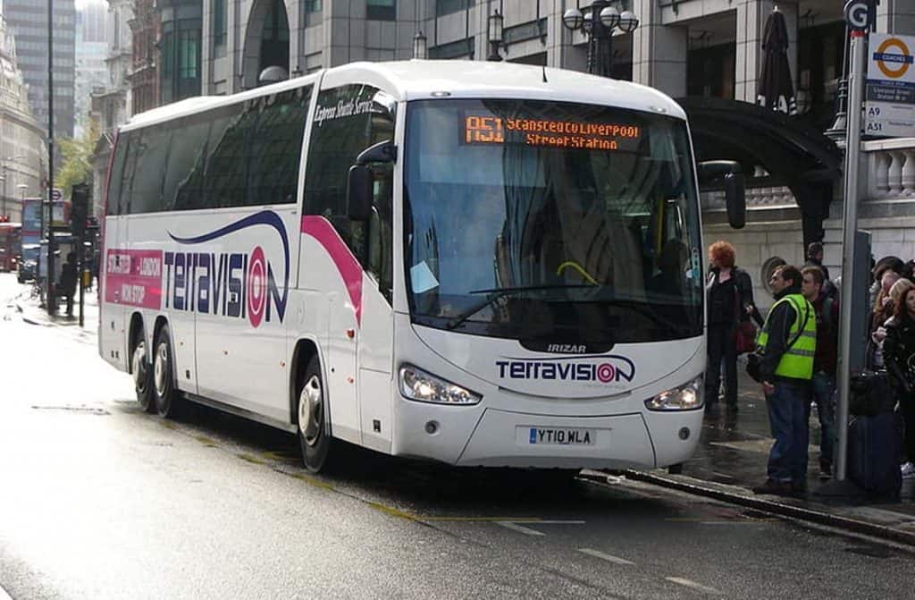 A Terravision coach parked at a stop, serving as an affordable airport transfer service across the UK.