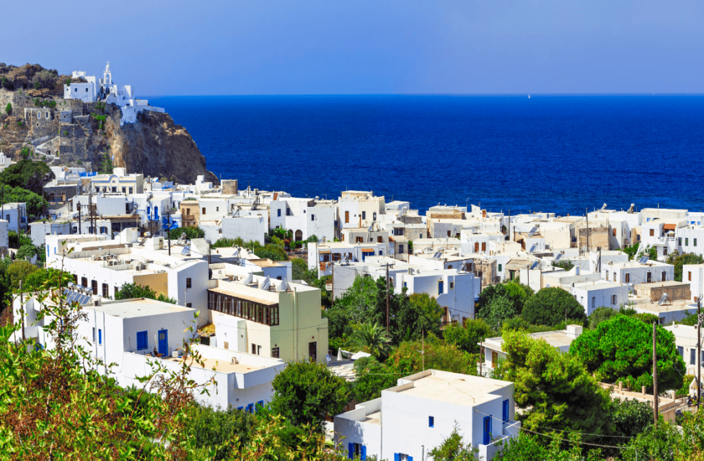 Scenic view of Nisyros Island, Greece, showcasing its volcanic landscape and traditional Greek architecture.