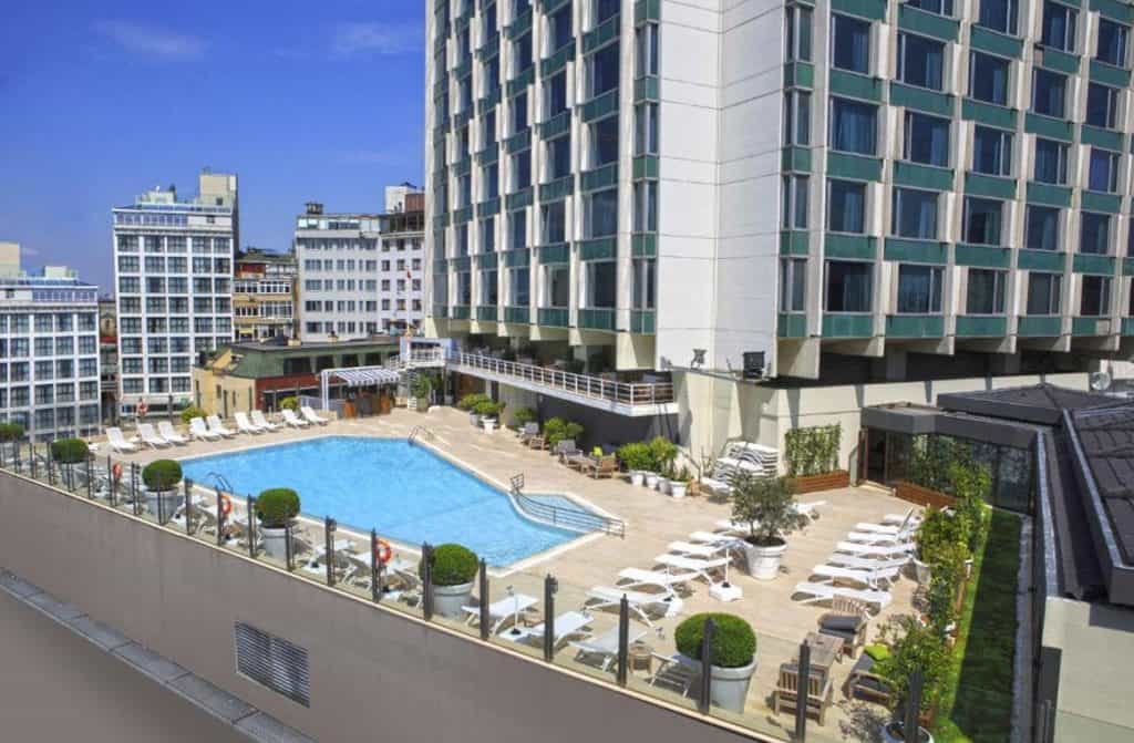 Elegant Marmara Taksim hotel, showcasing Istanbul's skyline and luxurious ambiance.