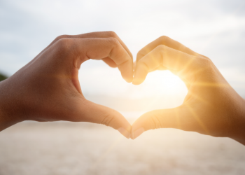 Two hands forming a heart shape, symbolising love and connection.